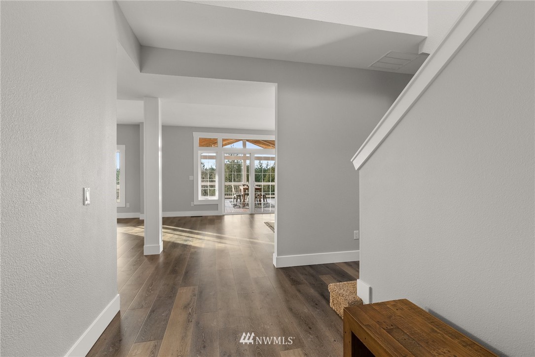 14126 Littlerock Road Southwest Rochester, WA 98579 - Photo 8 of 40 wooden floor in an empty room with a window