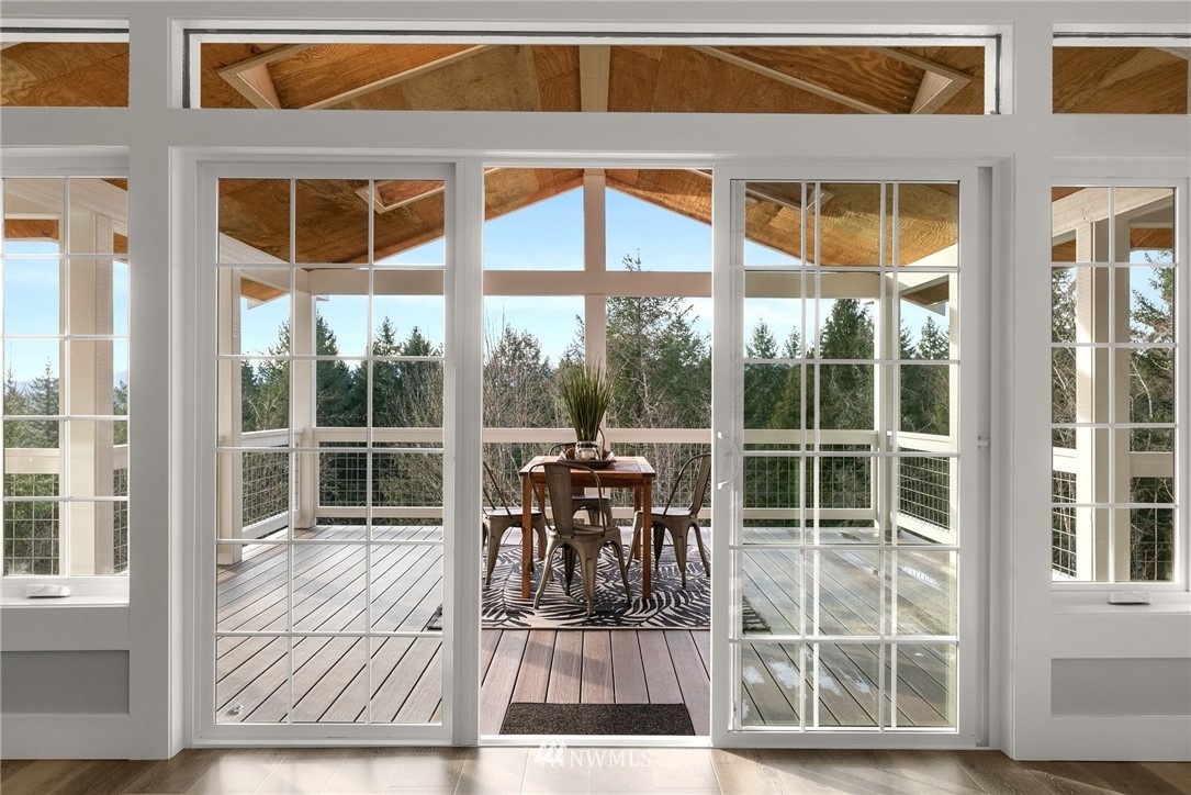 14126 Littlerock Road Southwest Rochester, WA 98579 - Photo 10 of 40 a view of a chair and table on the wooden floor