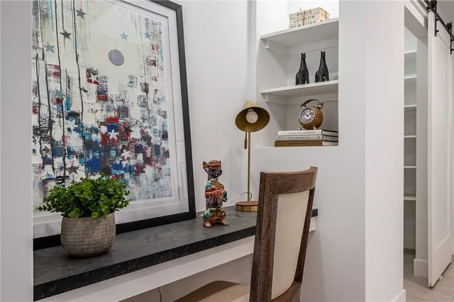 a table with a vase and flowers on it