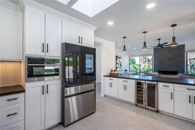 a kitchen with stainless steel appliances granite countertop a stove and a refrigerator