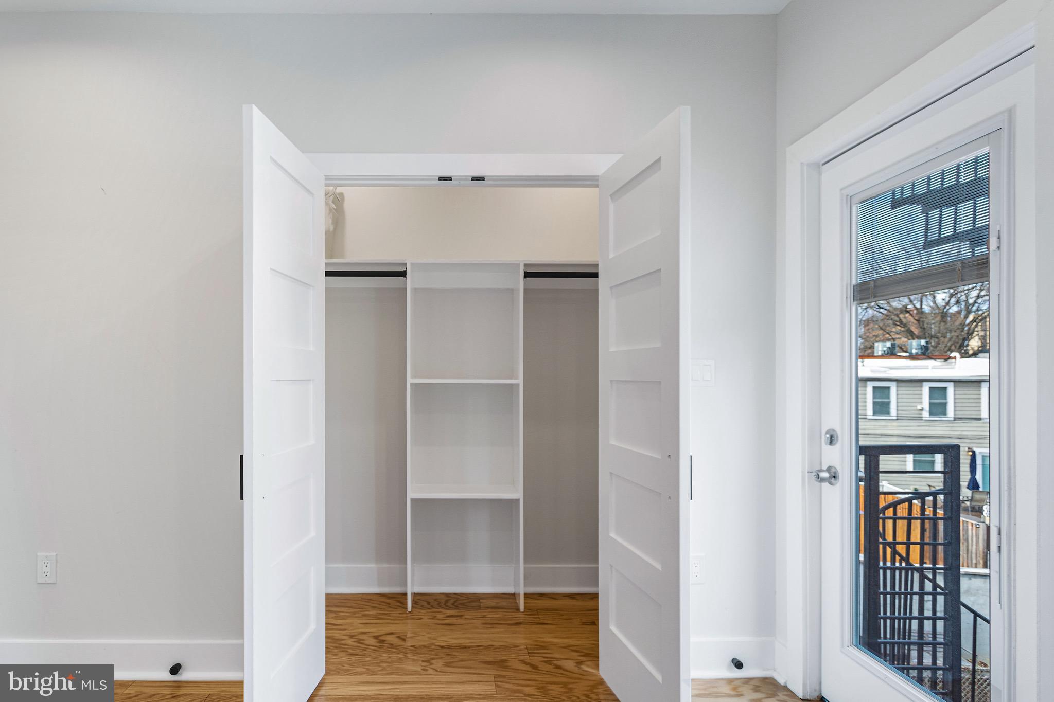 1118 Neal Street Northeast, Unit 2 Washington, DC 20002 - Photo 18 of 25 a view of walk in closet with empty racks