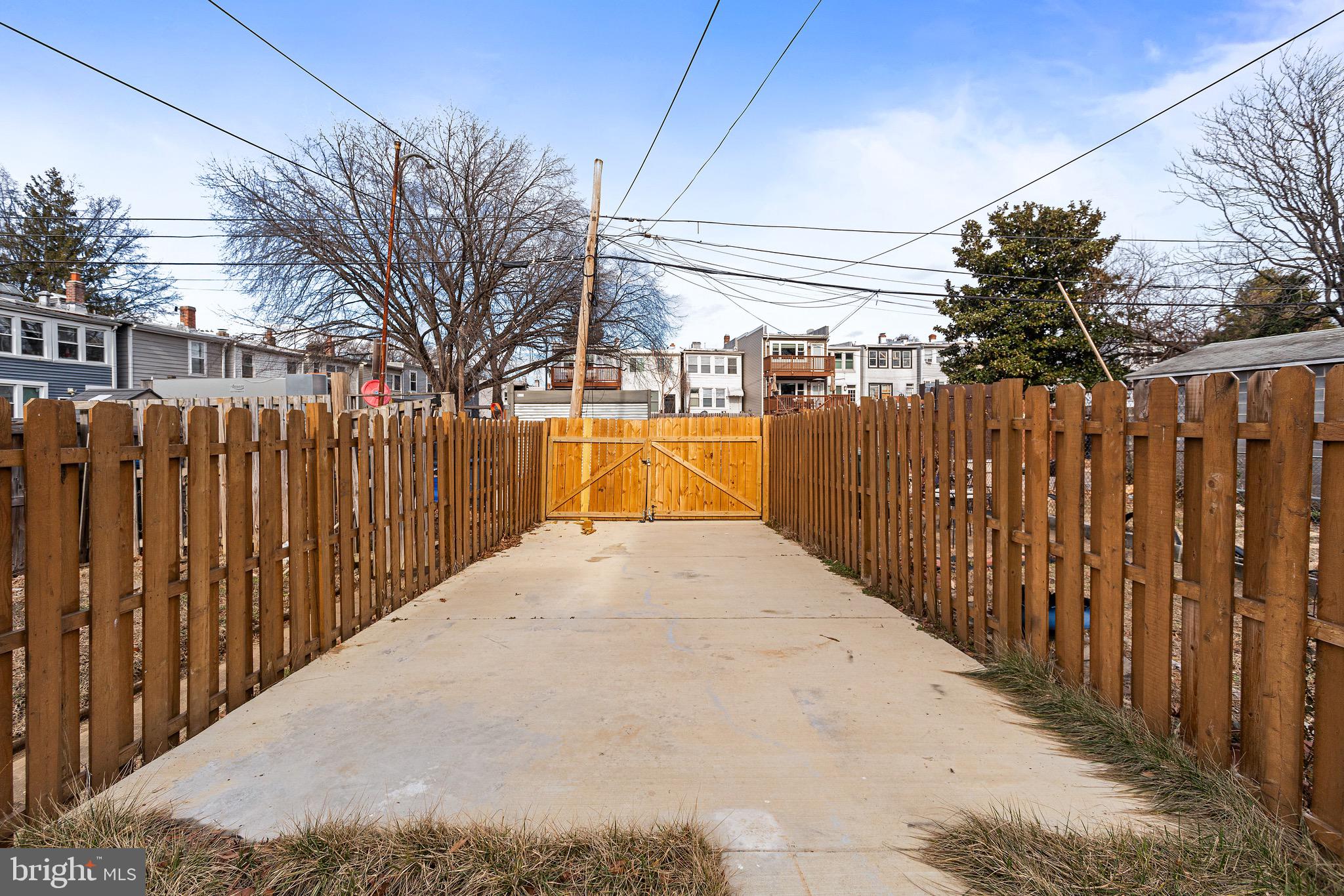 1118 Neal Street Northeast, Unit 2 Washington, DC 20002 - Photo 22 of 25 a view of a pathway with a wrought fence