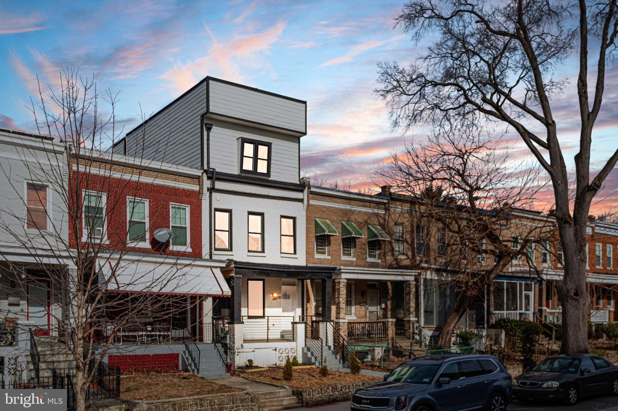 1118 Neal Street Northeast, Unit 2 Washington, DC 20002 - Photo 23 of 25 a front view of a residential apartment building with a yard