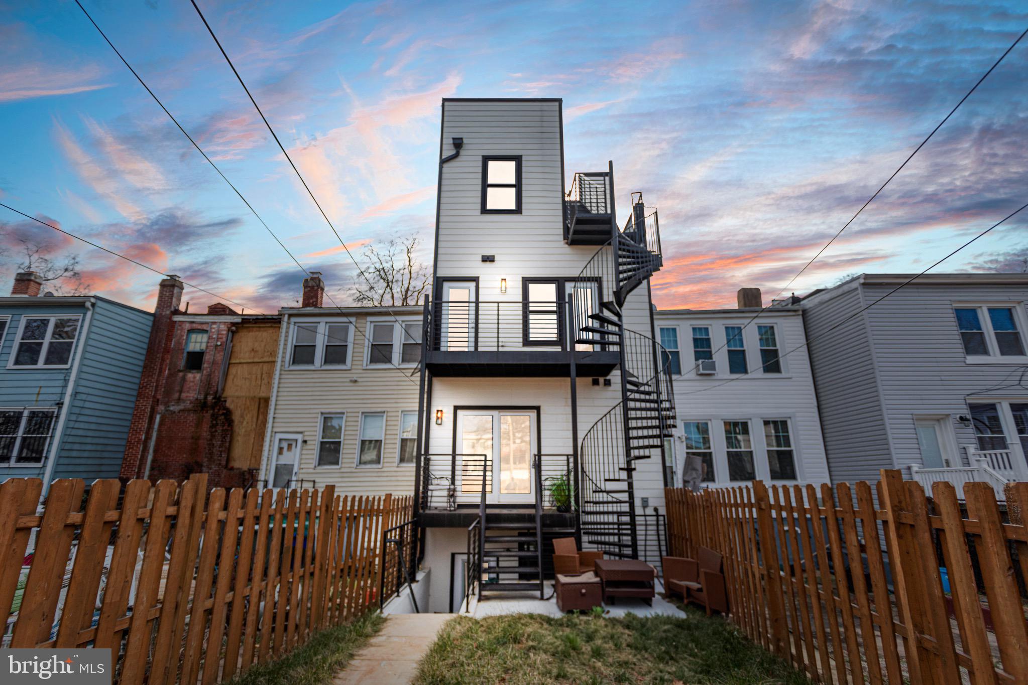 1118 Neal Street Northeast, Unit 2 Washington, DC 20002 - Photo 24 of 25 a view of a house with wooden fence