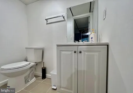 a bathroom with a toilet and a sink