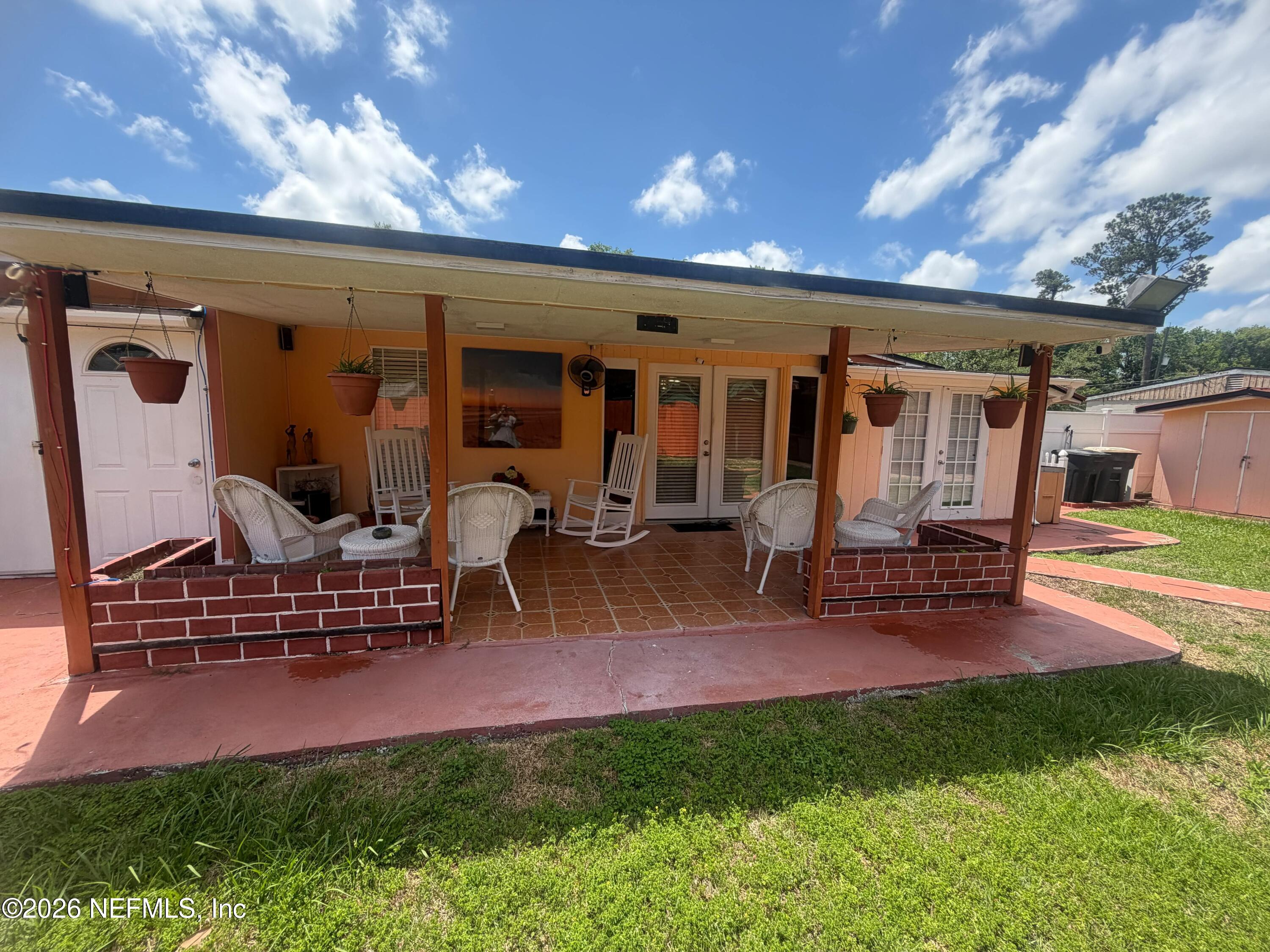 4127 Springwood Road Jacksonville, FL 32207 - Photo 36 of 63 a view of outdoor space yard deck patio and outdoor kitchen