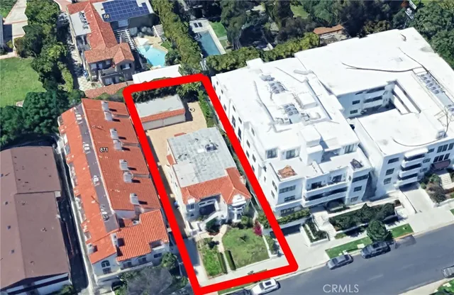 an aerial view of residential houses with outdoor space