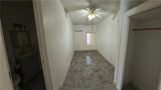 a bathroom with a shower and a toilet sink