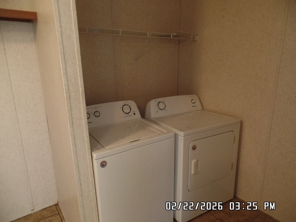 686 Ramar Road Bullhead City, AZ 86442 - Photo 12 of 22 a utility room with dryer and washer