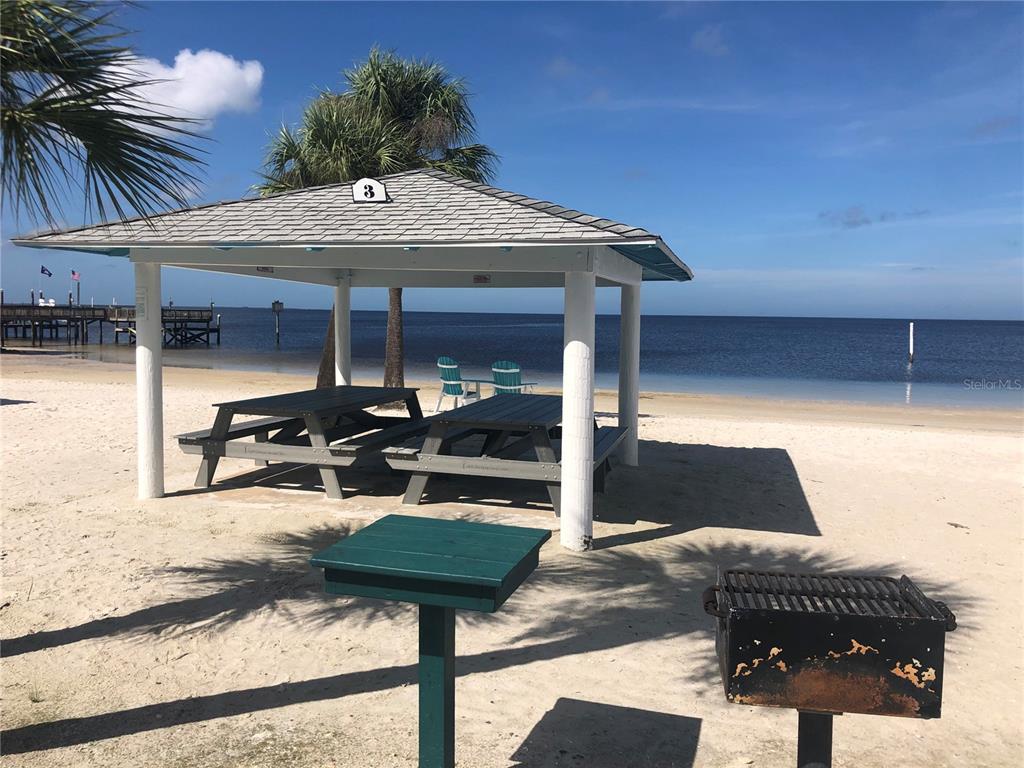 13 Captains Court New Port Richey, FL 34652 - Photo 17 of 35 a view of a patio with table and chairs