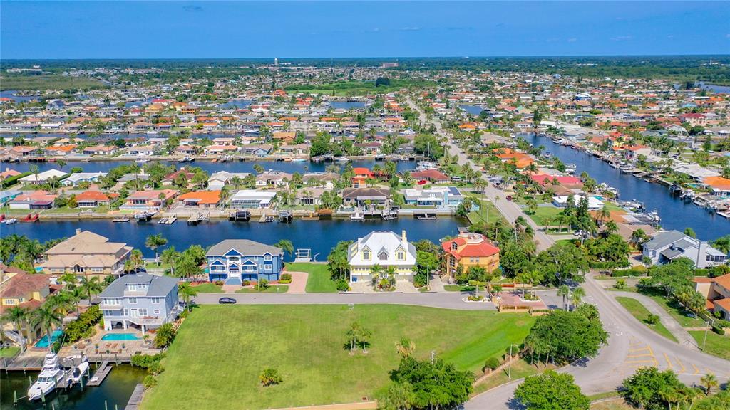 13 Captains Court New Port Richey, FL 34652 - Photo 21 of 35 an aerial view of a city with lots of residential buildings ocean and mountain view in back