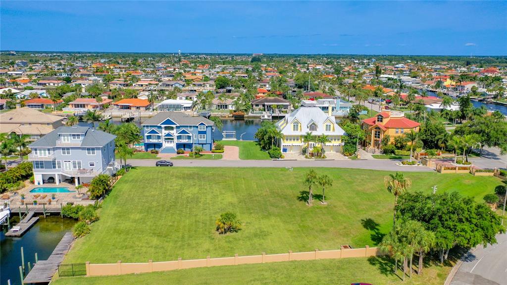 13 Captains Court New Port Richey, FL 34652 - Photo 25 of 35 a view of swimming pool outdoor seating and lake view