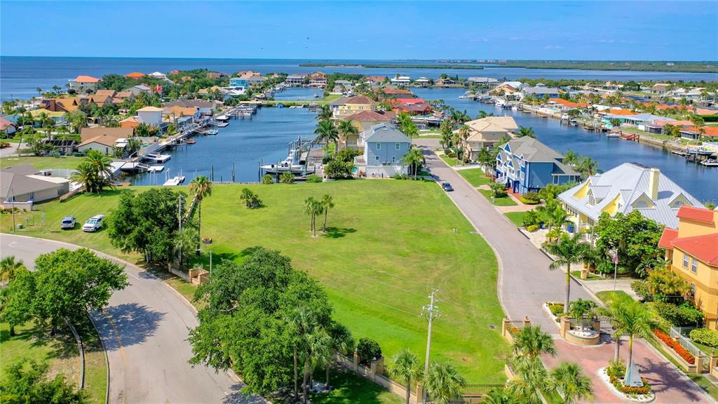 13 Captains Court New Port Richey, FL 34652 - Photo 28 of 35 an aerial view of residential houses with outdoor space and swimming pool