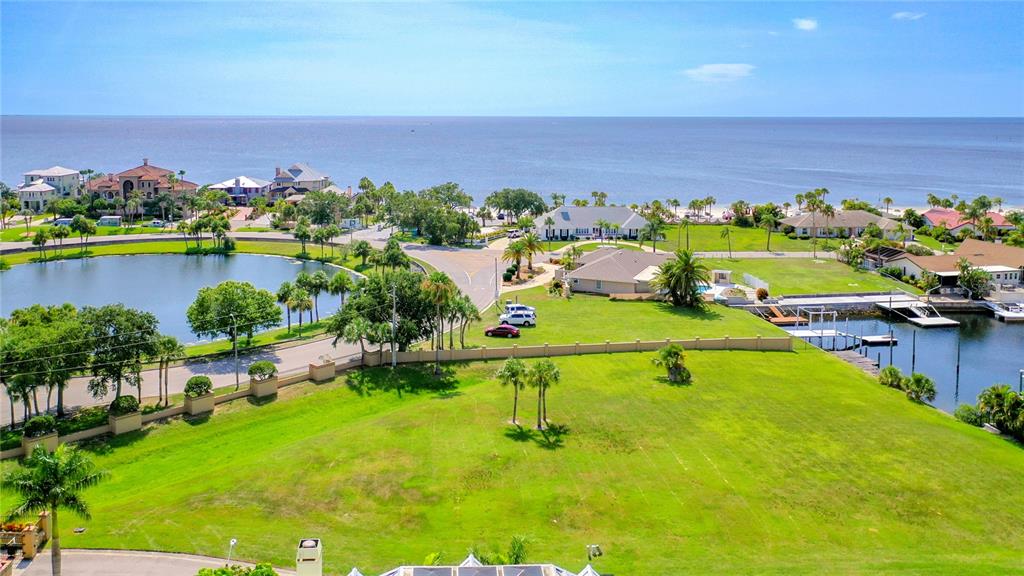 13 Captains Court New Port Richey, FL 34652 - Photo 31 of 35 a view of a lake with a city