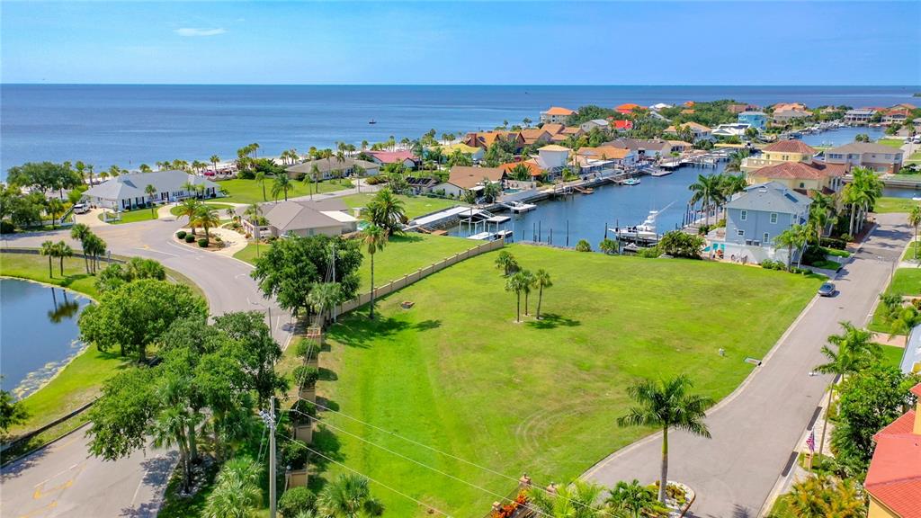 13 Captains Court New Port Richey, FL 34652 - Photo 32 of 35 an aerial view of beach and residential houses with outdoor space
