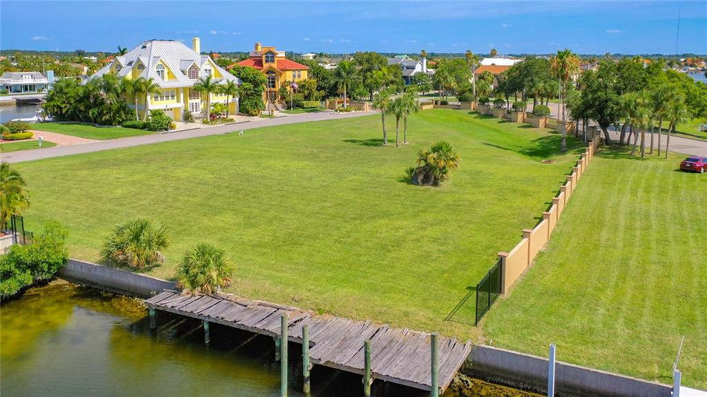 13 Captains Court New Port Richey, FL 34652 - Photo 5 of 35 a view of swimming pool with a garden and seating area