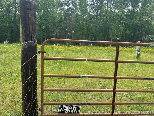 a view of a back yard from a balcony
