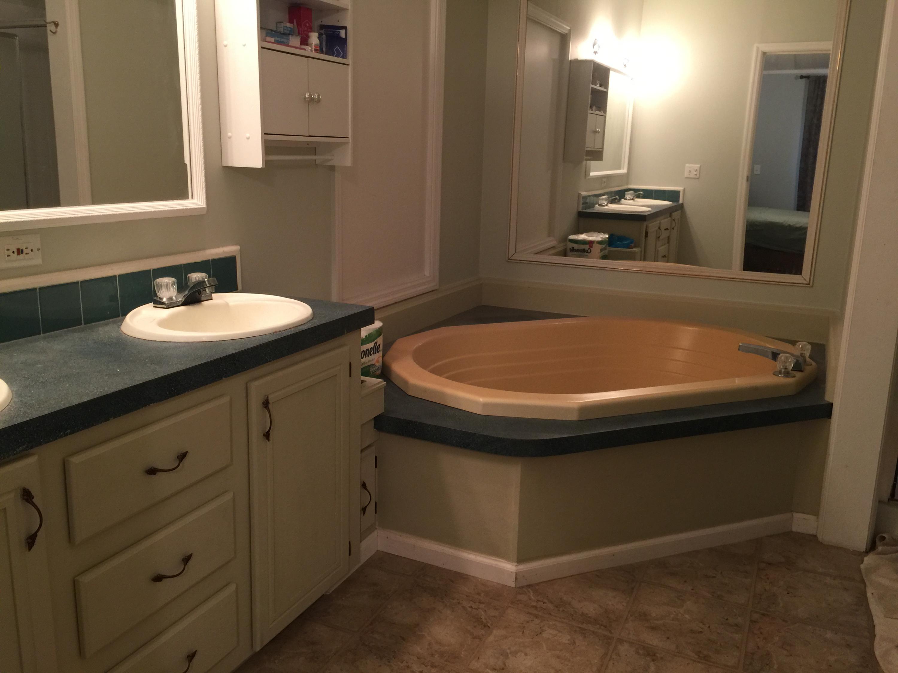 10441 Marina Way Boca Raton, FL 33428 - Photo 8 of 10 a bathroom with a sink and a mirror
