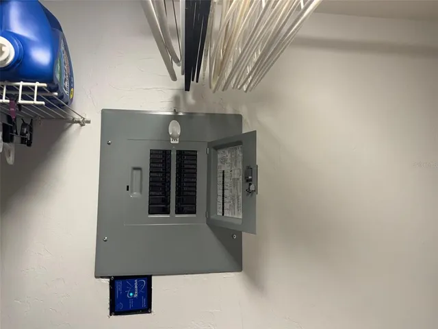 a view of storage and utility room with racks on the wall