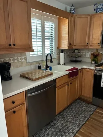 a bathroom with a sink a mirror and a window