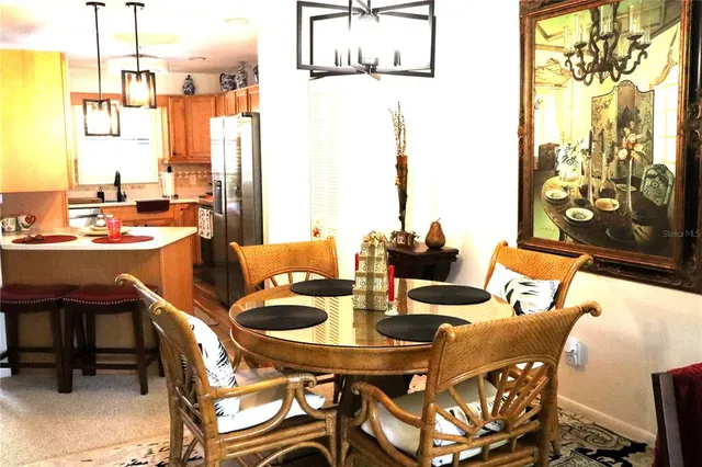 a living room with furniture and floor to ceiling windows