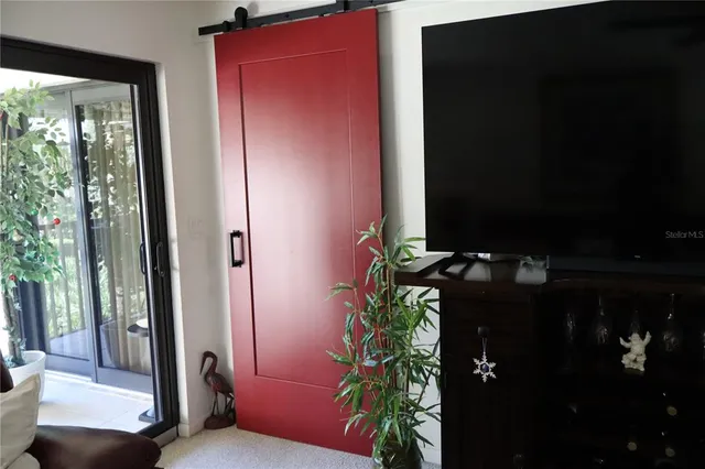 a bedroom with a bed and a mirror