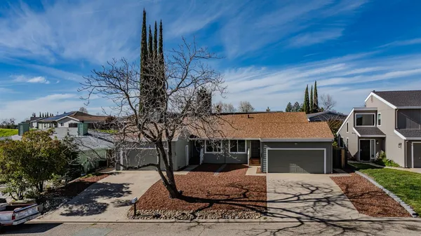 a front view of a house with yard