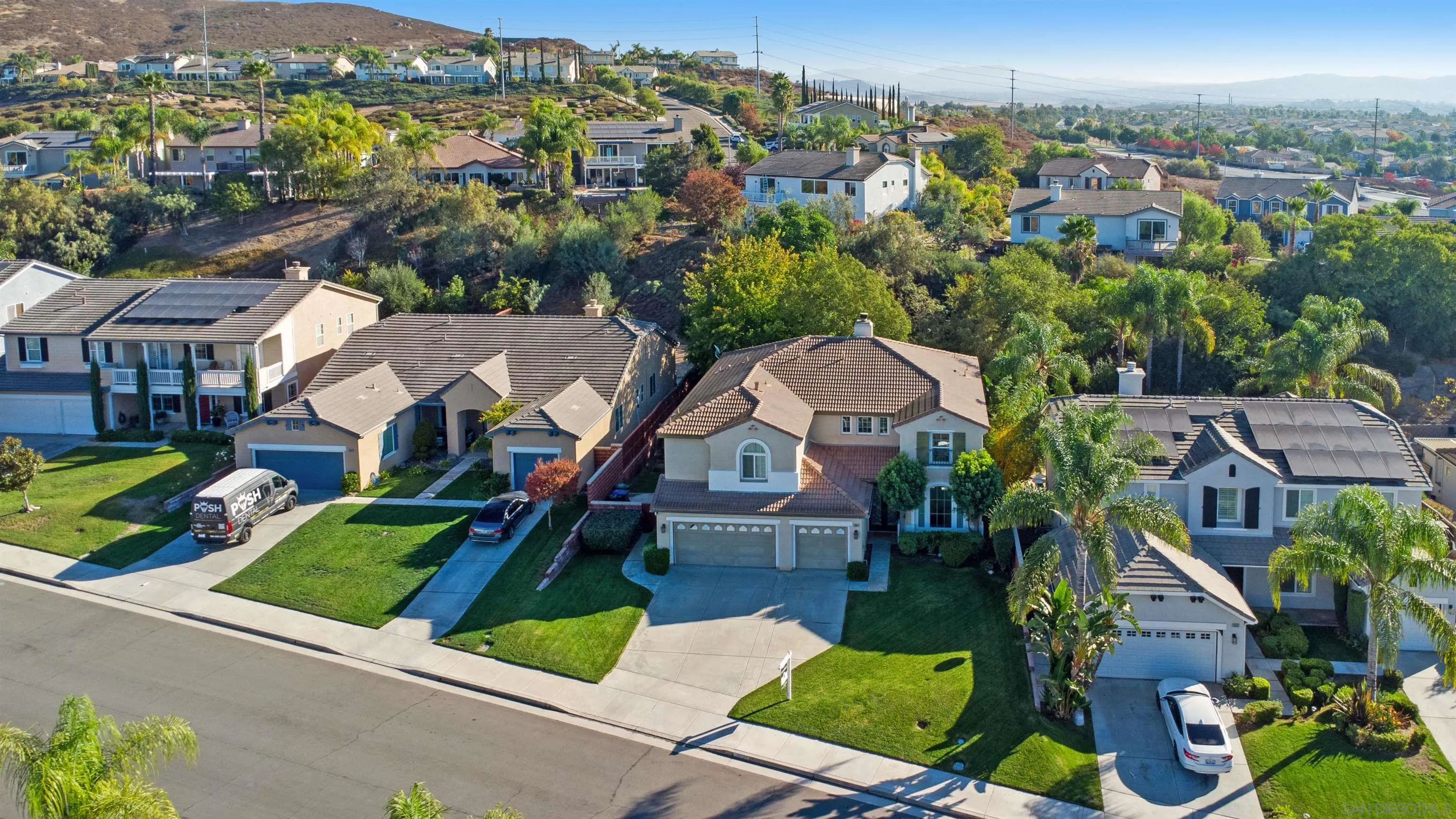 38944 Cherry Point Lane Murrieta, CA 92563 - Photo 30 of 40 an aerial view of multiple houses with a yard