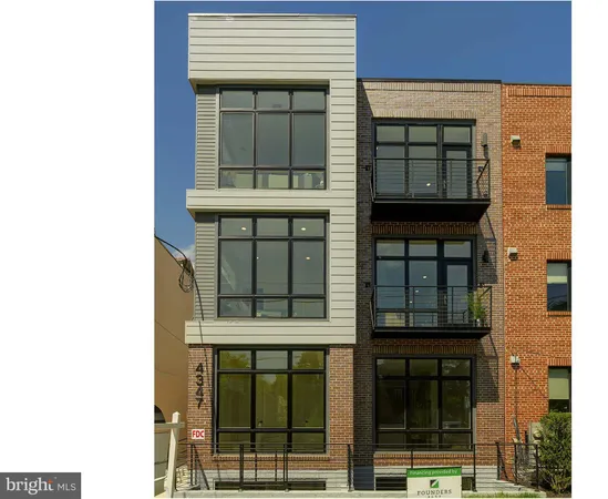 a open kitchen with stainless steel appliances granite countertop a stove oven a sink dishwasher and a dining table with wooden floor