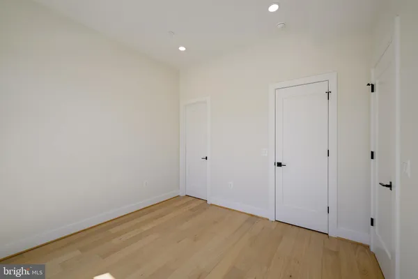 a view of a brick building next to a yard