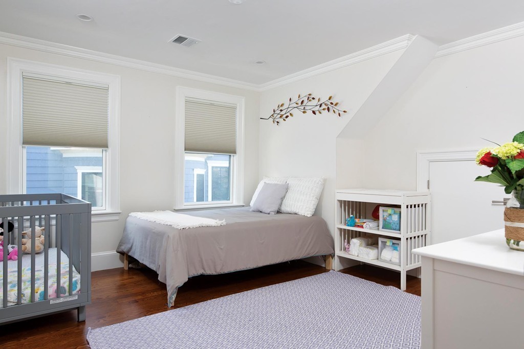 27 Summit Avenue, Unit 27 Brookline, MA 02446 - Photo 12 of 21 a bedroom with a bed and a window