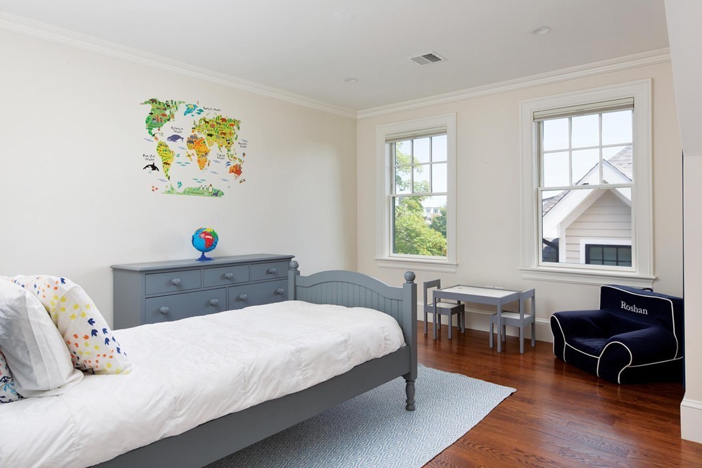 27 Summit Avenue, Unit 27 Brookline, MA 02446 - Photo 13 of 21 a bedroom with a bed and a desk