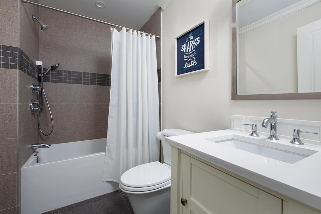 27 Summit Avenue, Unit 27 Brookline, MA 02446 - Photo 14 of 21 a bathroom with a sink toilet and shower