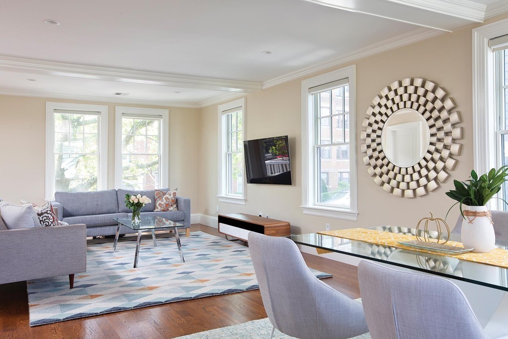 27 Summit Avenue, Unit 27 Brookline, MA 02446 - Photo 3 of 21 a living room with furniture and a large window