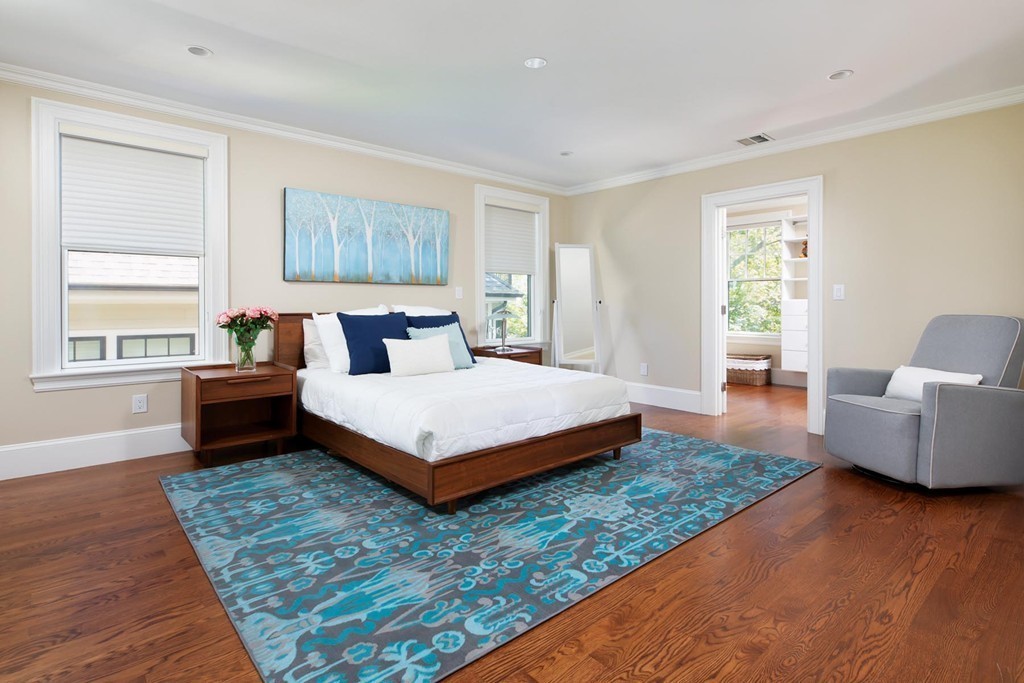 27 Summit Avenue, Unit 27 Brookline, MA 02446 - Photo 7 of 21 a bedroom with a large bed and a couch