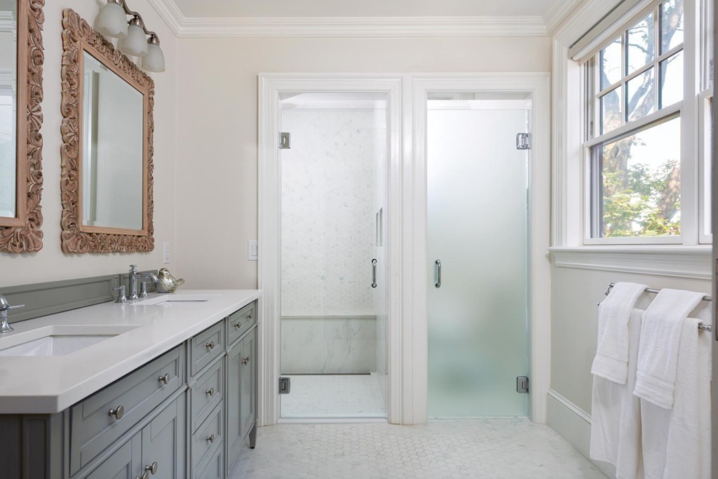 27 Summit Avenue, Unit 27 Brookline, MA 02446 - Photo 10 of 21 a bathroom with a sink a mirror and a shower