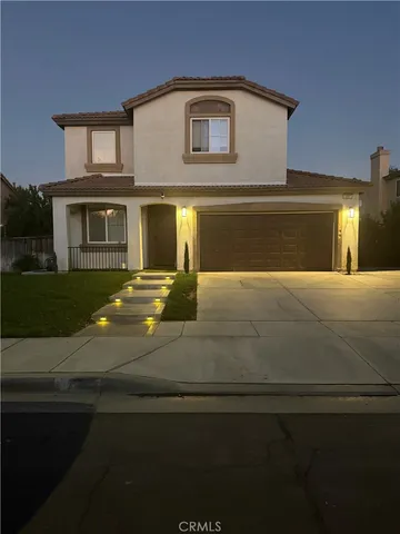 a front view of a house with yard