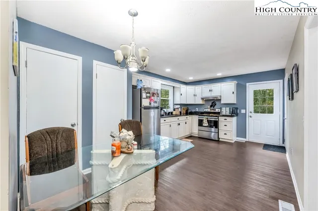 a open kitchen with sink cabinets and wooden floor