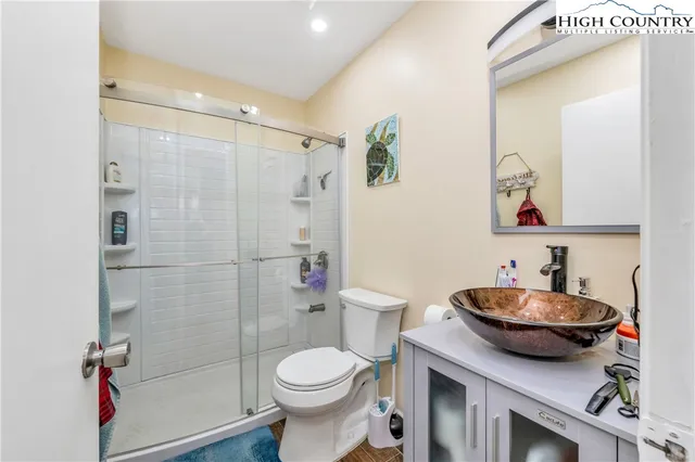 a view of kitchen center with appliances and cabinets