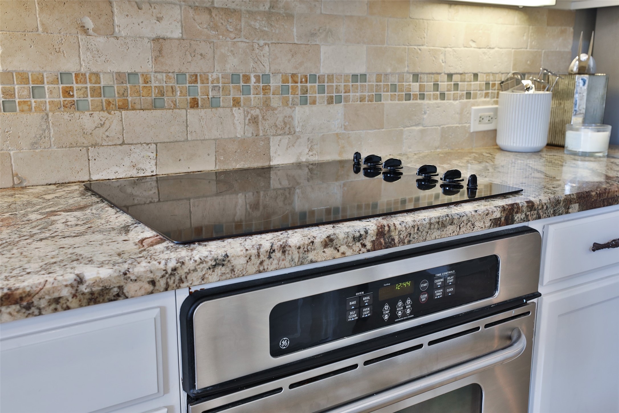 10514 Spice Ridge Row Missouri City, TX 77459 - Photo 18 of 43 a close view of a stove and a sink