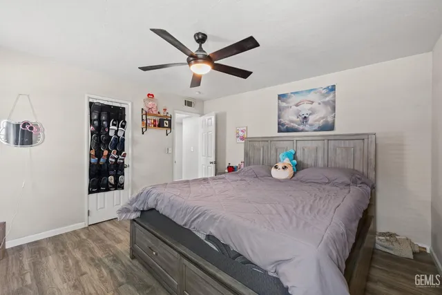 a bedroom with a bed and a table in it