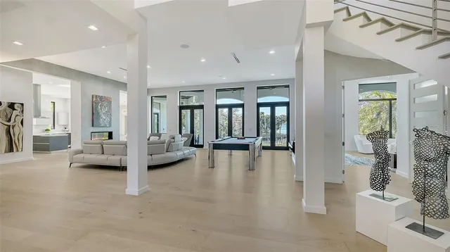a living room with furniture flower pot and a fireplace