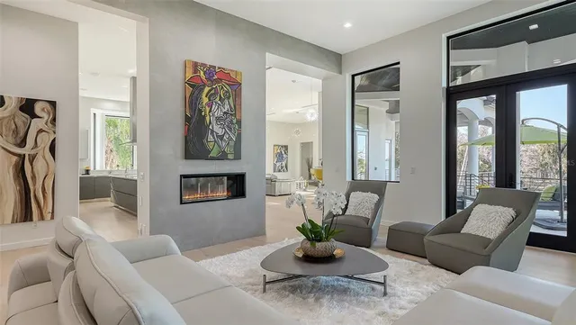 a kitchen with stainless steel appliances kitchen island a refrigerator sink and cabinets