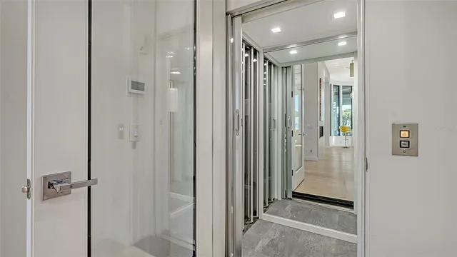 a bathroom with a sink a bathtub a window and a mirror