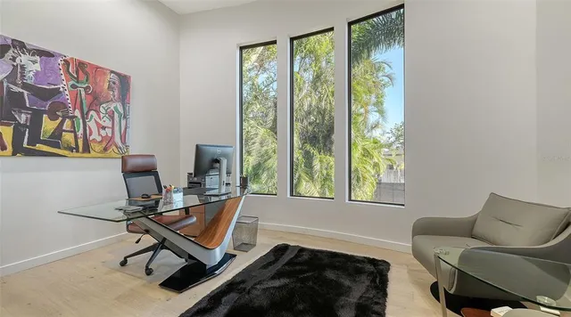 a spacious en suite bathroom with toilet sink and mirror