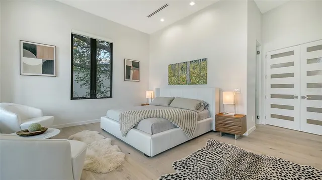 a view of a livingroom with a couch and a livingroom with bathroom