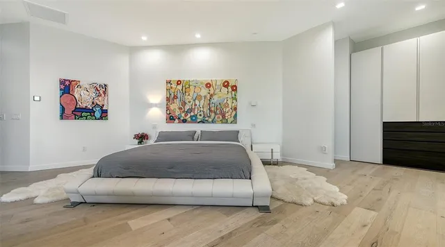 a bathroom with a sink and two mirror