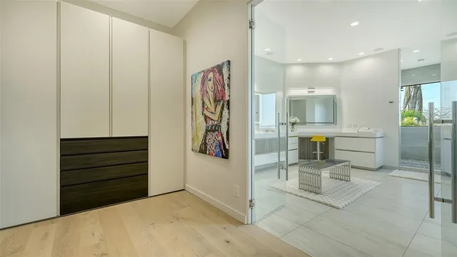 a view of a swimming pool with a yard and palm trees