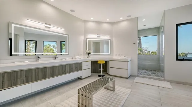 a front view of a house with garden and sitting area