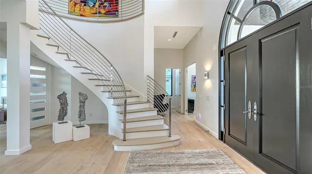 a view of a livingroom with furniture and bathroom